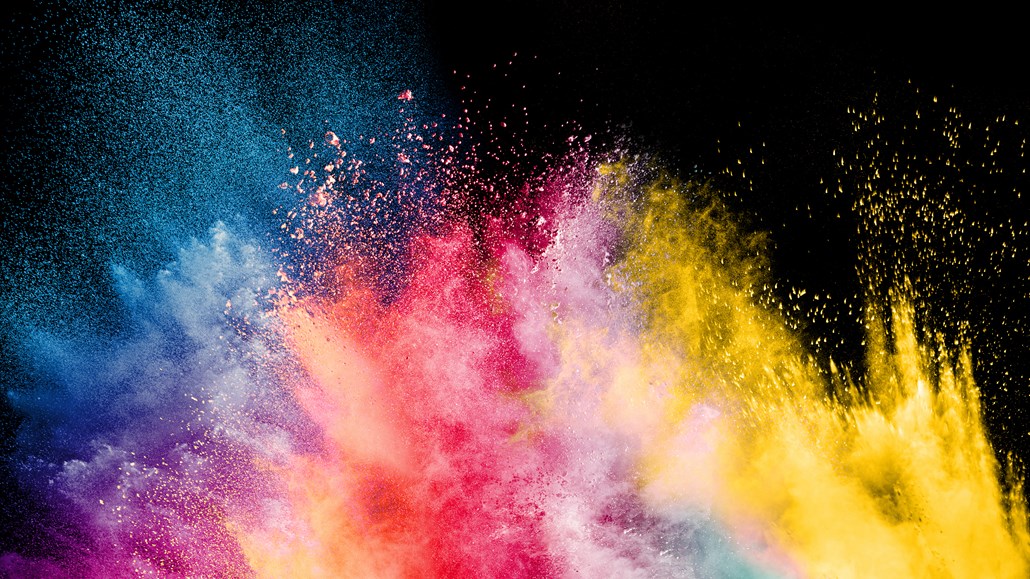 Explosion of rainbow colors on a black background