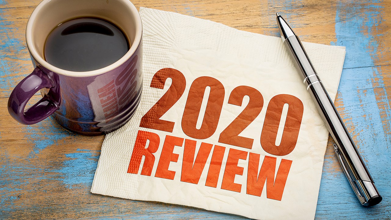 Napkin with 2020 Review written next to a cup filled with coffee